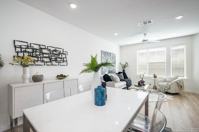 dining area featuring ceiling fan and hardwood / wood-style flooring