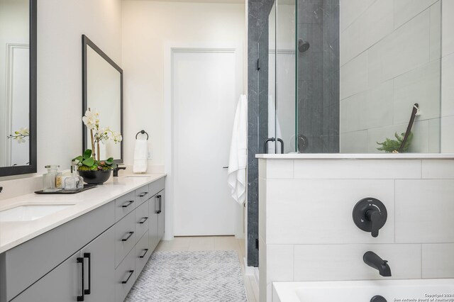 bathroom with vanity, tile patterned floors, and independent shower and bath