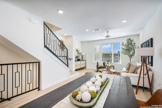 living room with hardwood / wood-style floors and ceiling fan