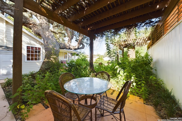 view of patio / terrace with outdoor dining space and a pergola