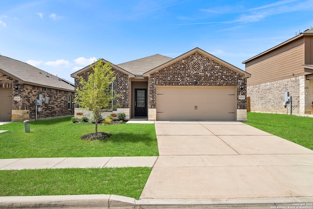 view of front of house with a front yard and a garage