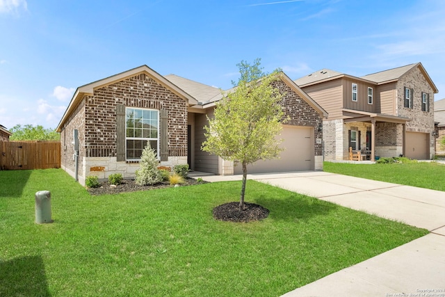 view of front of property featuring a front yard and a garage