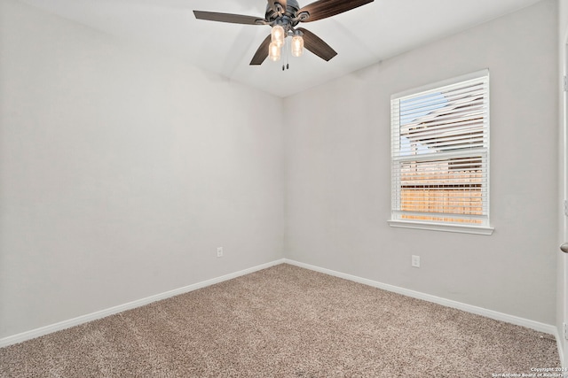 carpeted empty room featuring ceiling fan