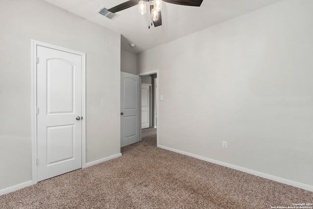 unfurnished bedroom featuring carpet and ceiling fan