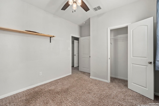 unfurnished bedroom featuring ceiling fan, a closet, and light carpet