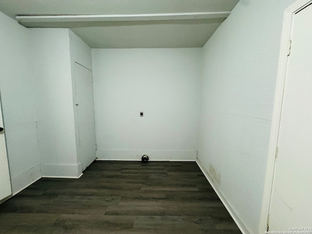 laundry room with dark hardwood / wood-style floors and electric dryer hookup