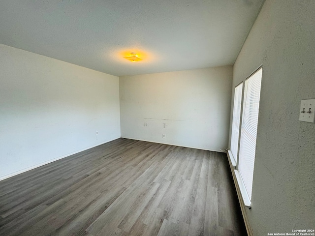 spare room featuring hardwood / wood-style flooring