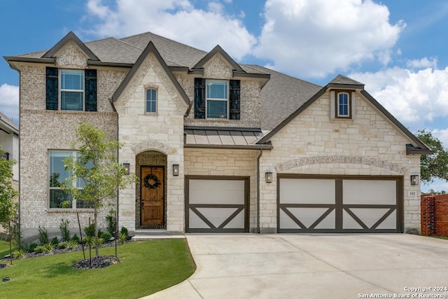 view of front facade with a front lawn and a garage