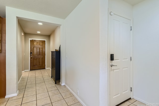 hallway with light tile patterned floors