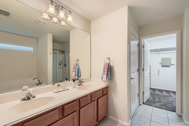 bathroom featuring vanity, tile patterned floors, and separate shower and tub