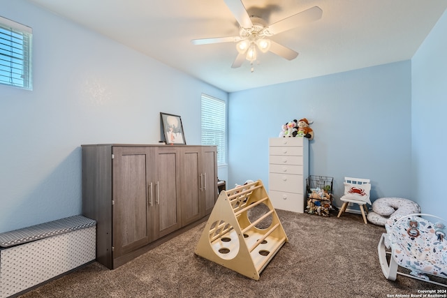 carpeted bedroom with ceiling fan