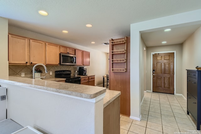 kitchen featuring sink, black electric range, kitchen peninsula, decorative backsplash, and light tile patterned flooring