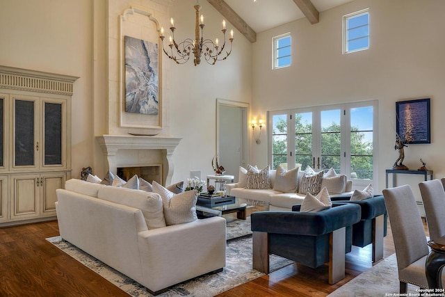 living room with an inviting chandelier, dark hardwood / wood-style floors, beam ceiling, and a high ceiling