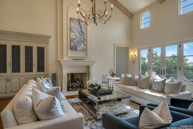 living room with beamed ceiling, a notable chandelier, french doors, and a high ceiling