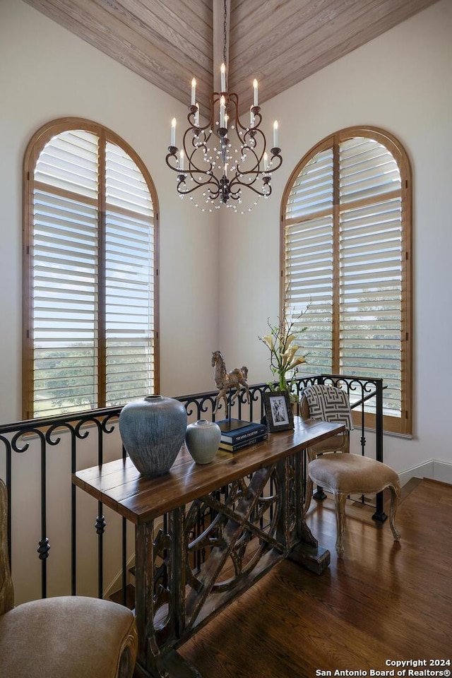 dining area featuring hardwood / wood-style flooring, a wealth of natural light, and wood ceiling