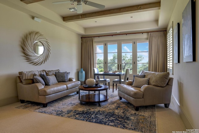 carpeted living room featuring ceiling fan, beam ceiling, and french doors