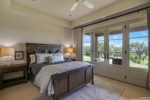 carpeted bedroom with access to outside, french doors, and ceiling fan