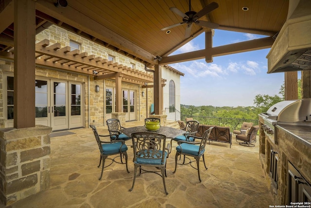 view of patio featuring ceiling fan, an outdoor kitchen, grilling area, and french doors