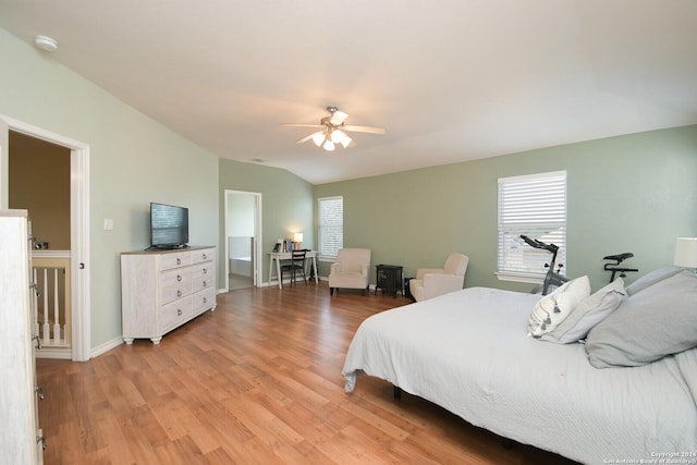 bedroom with vaulted ceiling, ceiling fan, baseboards, and light wood-style floors