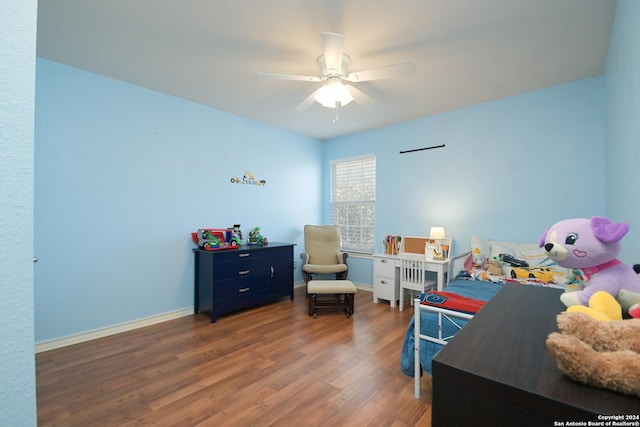 bedroom featuring ceiling fan and dark wood-type flooring