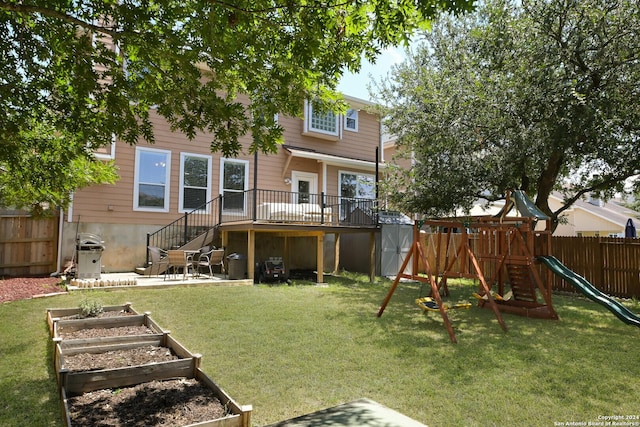 back of property featuring a garden, a fenced backyard, a playground, and a yard