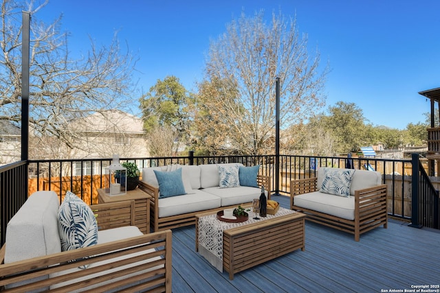 wooden terrace featuring outdoor lounge area