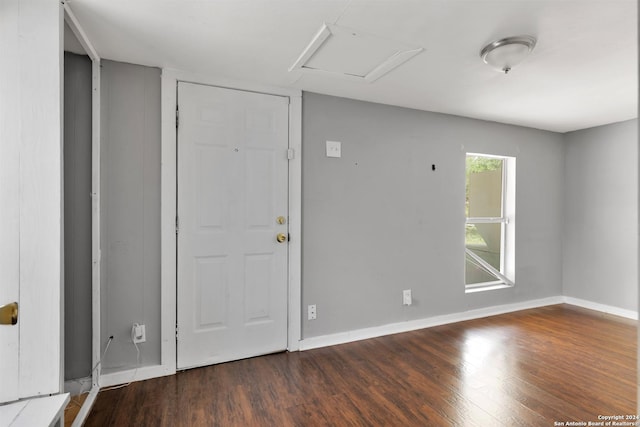 entryway with dark wood-type flooring