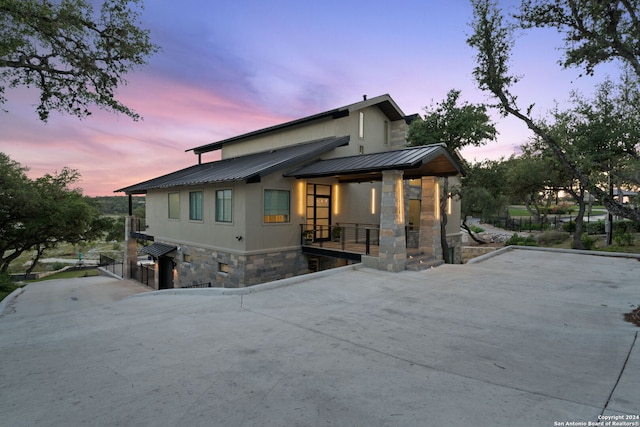 view of property exterior at dusk