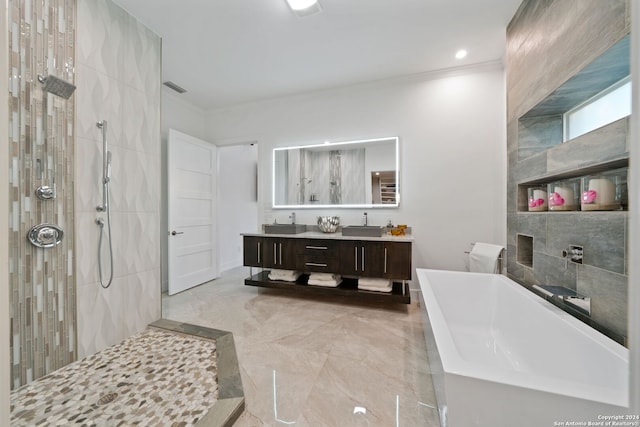 bathroom with vanity, separate shower and tub, and ornamental molding