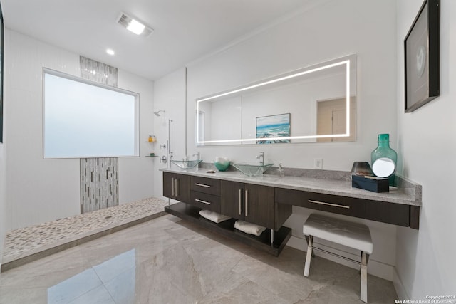 bathroom featuring vanity, walk in shower, and crown molding