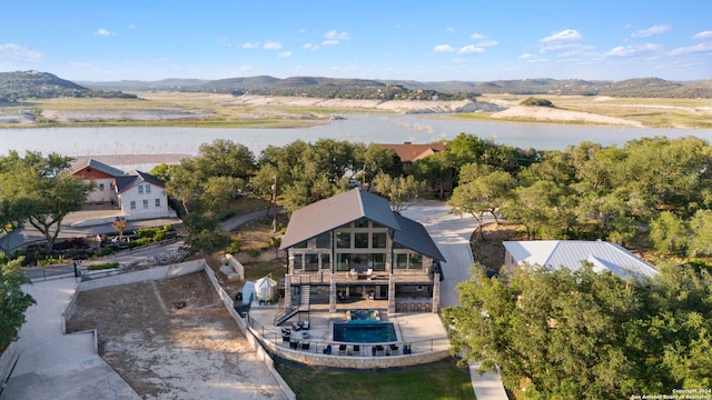 bird's eye view featuring a water and mountain view