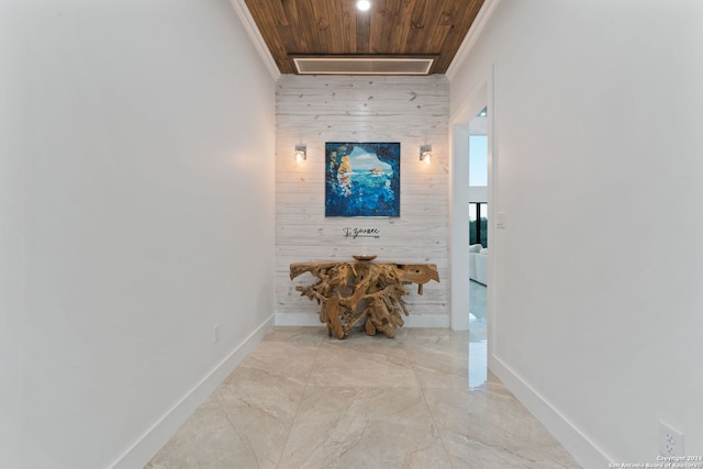 corridor featuring wood walls, wood ceiling, and ornamental molding