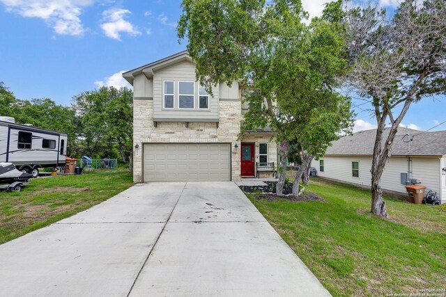 view of front facade featuring a garage and a front lawn