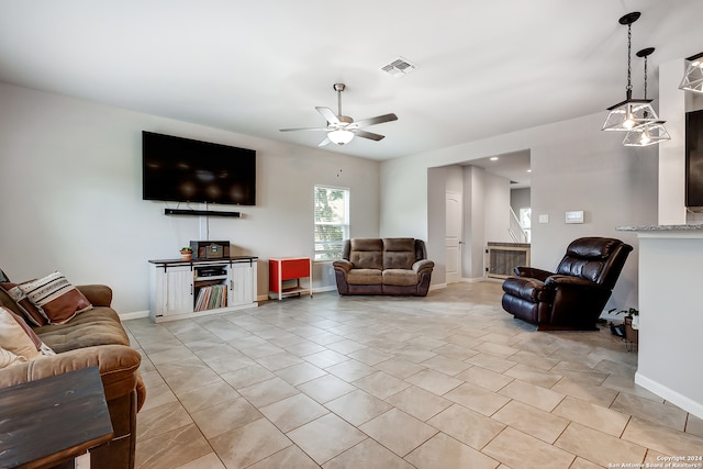 living room with light tile patterned floors and ceiling fan