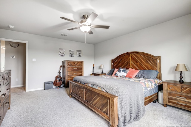 bedroom featuring ceiling fan and light carpet