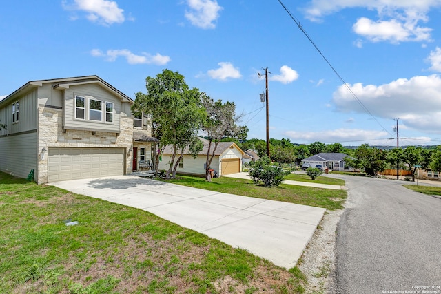 view of front of house with a garage and a front lawn