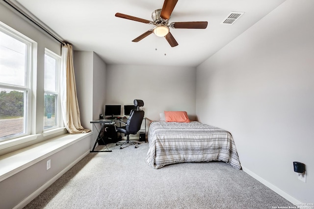 bedroom featuring ceiling fan and light colored carpet