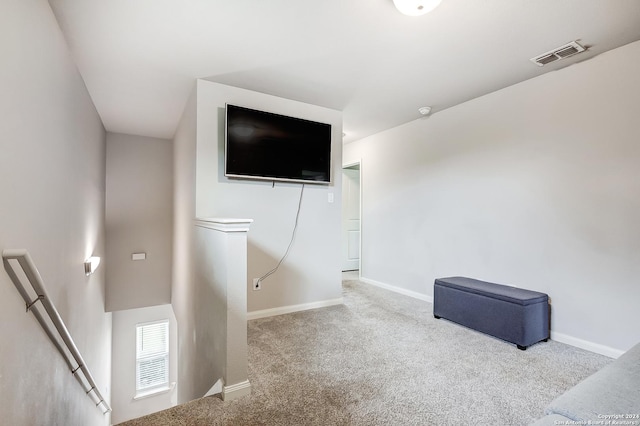 interior space featuring light colored carpet