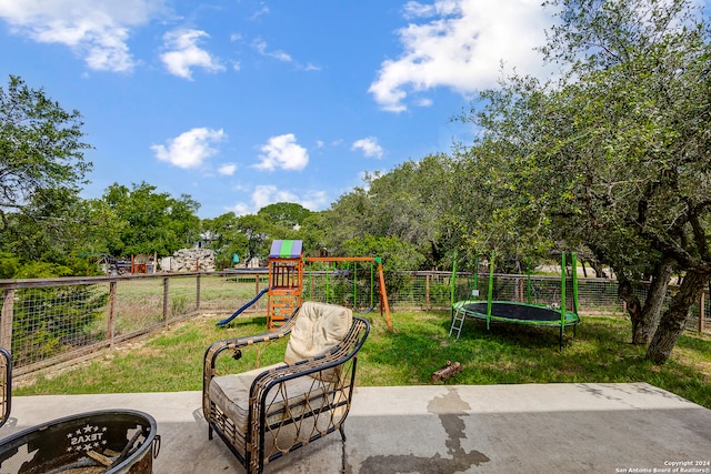 view of patio / terrace with a playground and a trampoline