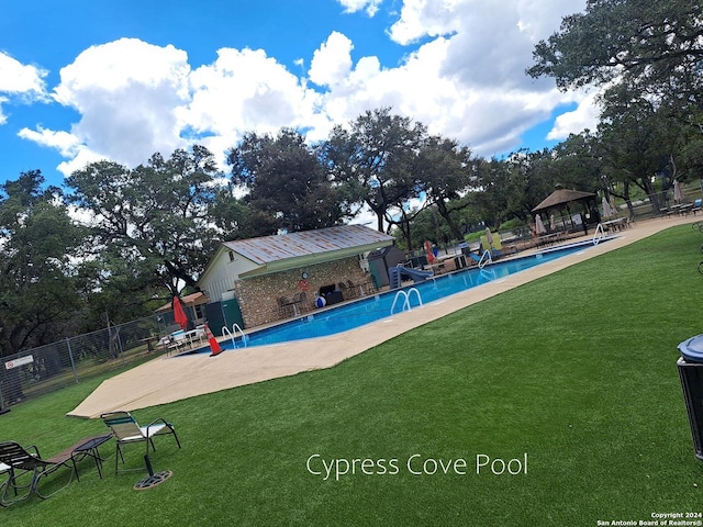 view of pool with a yard and a gazebo