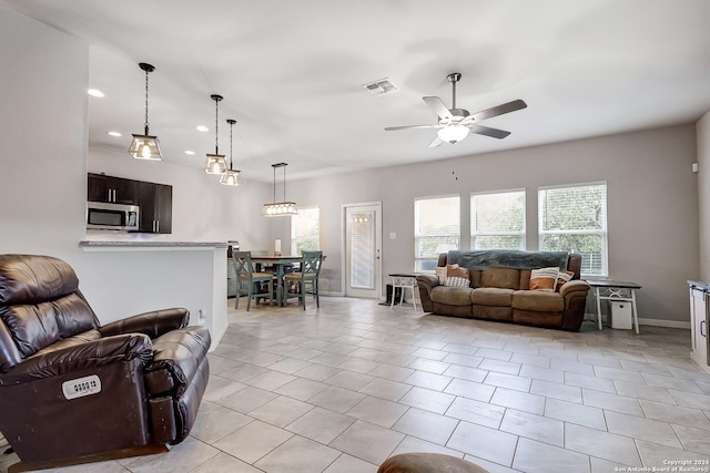 tiled living room featuring ceiling fan