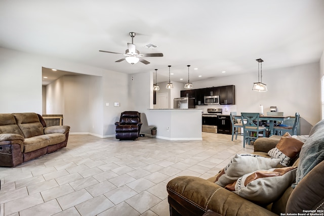 tiled living room with ceiling fan