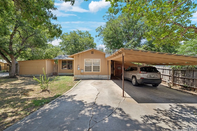 view of front of home with a carport