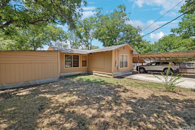 exterior space featuring a carport