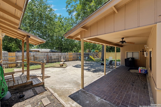 view of patio featuring a playground and ceiling fan