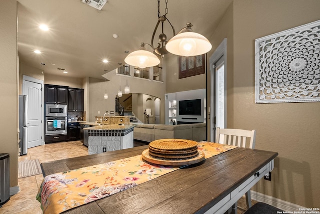 tiled dining area featuring sink