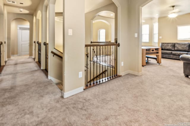 corridor with light carpet