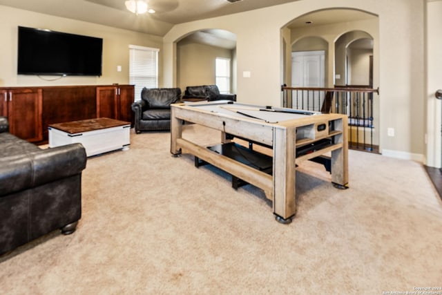 recreation room with ceiling fan, light carpet, and pool table