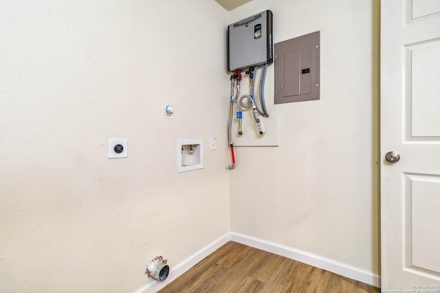 washroom featuring washer hookup, electric dryer hookup, hardwood / wood-style floors, electric panel, and hookup for a gas dryer