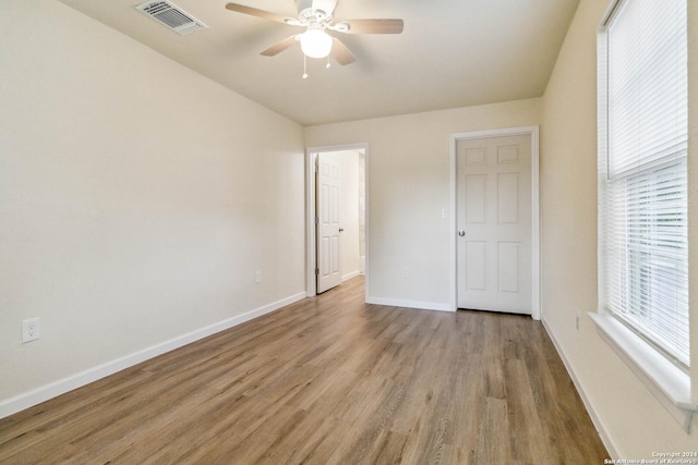 unfurnished bedroom featuring ceiling fan and light hardwood / wood-style flooring